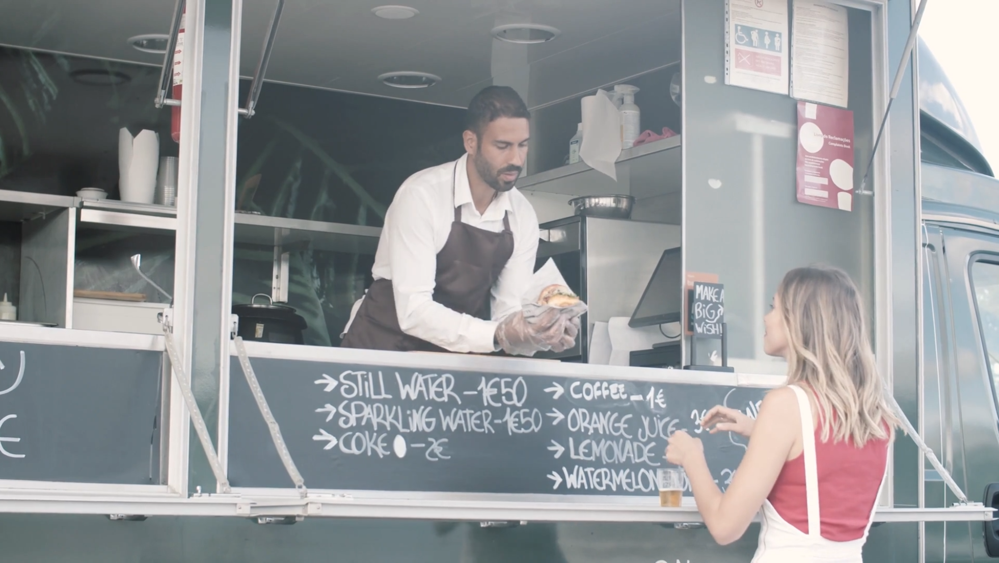 Busy food truck festival with customers ordering on phones despite poor cell service